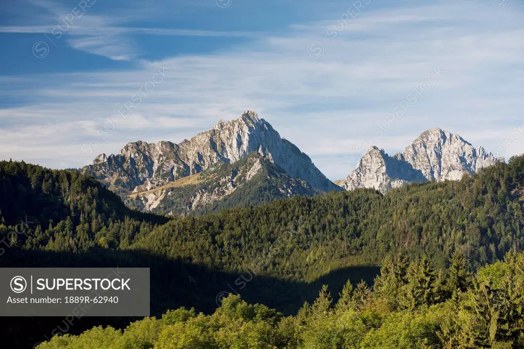 mountain peaks with hilly forests, fussen, germany