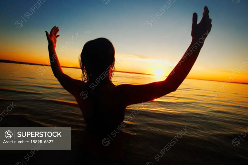 Woman with hands raised