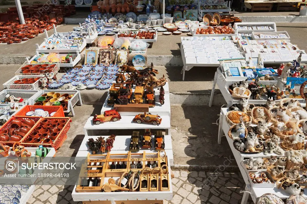 souvenirs set on tables at the seaside town of nazare, nazare, estremadura and ribatejo, portugal