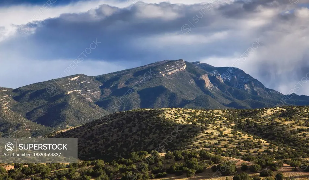 storm passes over the sandia mountains, viewed from placitas, new mexico, united states of america