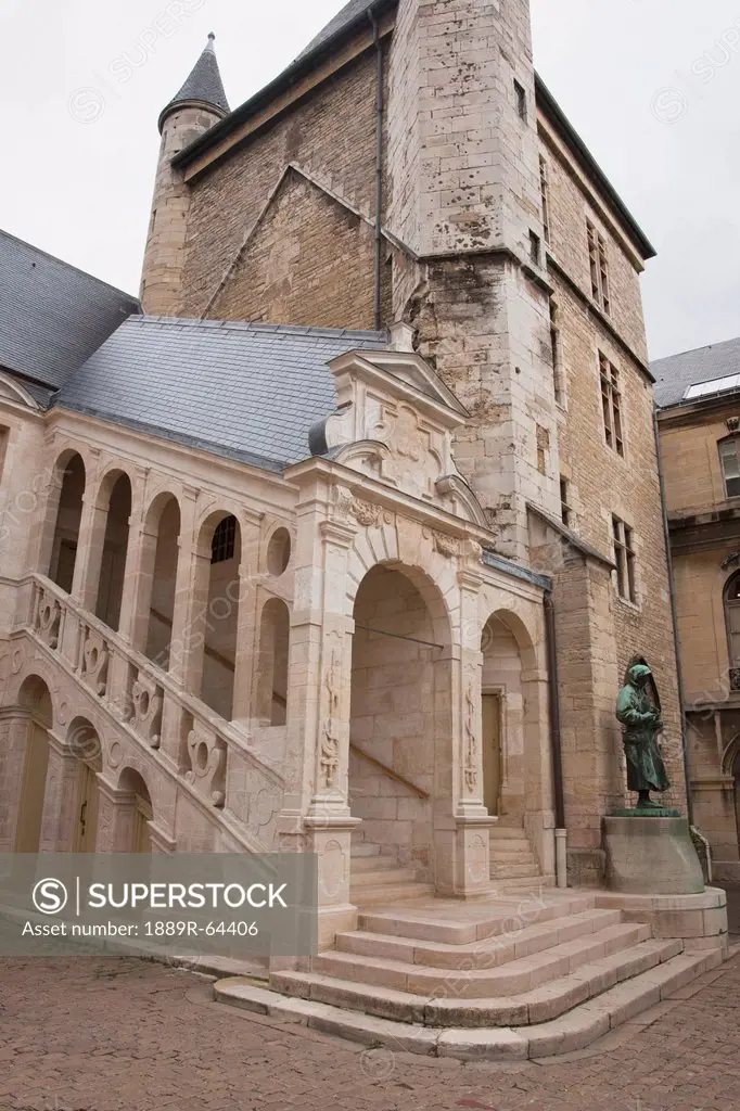 a historic building with a tower build by belin de comblanchien, beaune, cote d´or, france