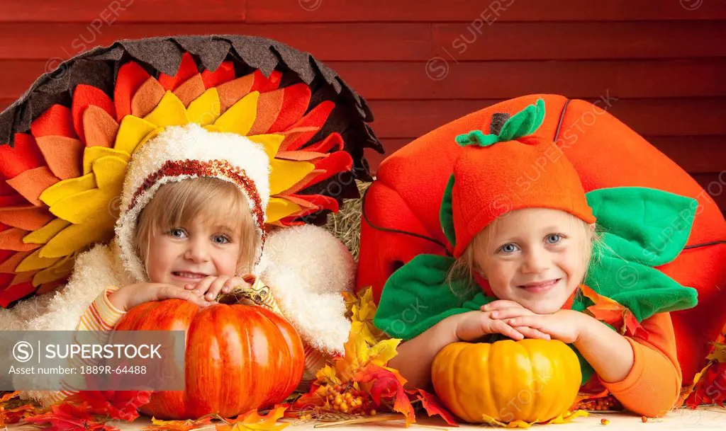 two children wearing turkey and tomato costumes, three hills, alberta, canada
