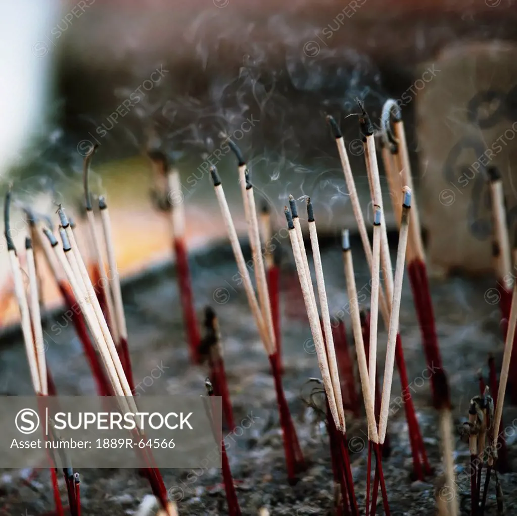 close_up of incense sticks in wat phrathat doi suthep temple, chiang mai, thailand