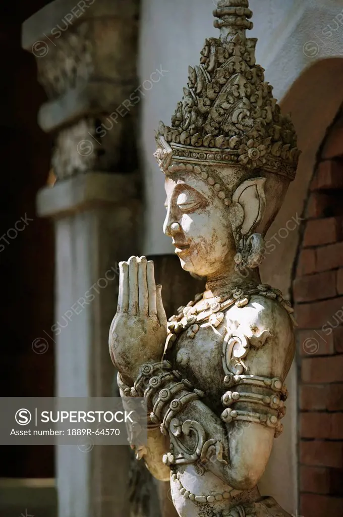 buddhist statue at mandarin oriental dhara dhevi hotel, chiang mai, thailand