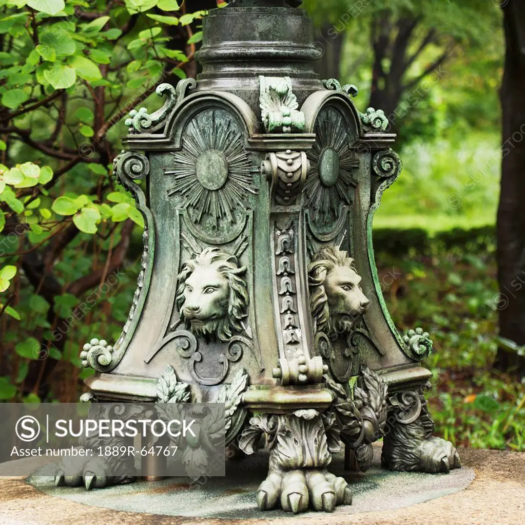 decorative base of a stand with lion heads and claw feet at imperial palace, tokyo, japan