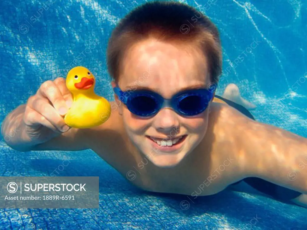 Child at the bottom of swimming pool