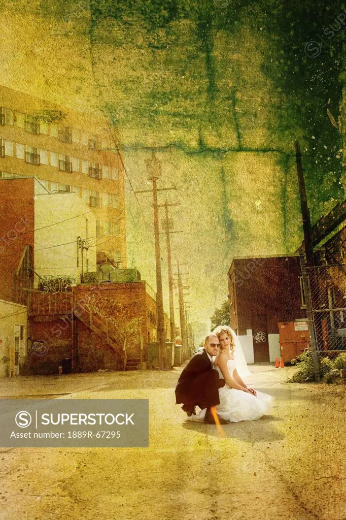 a bride and groom in an urban scene