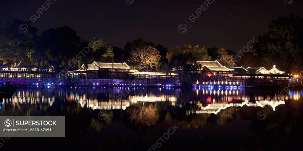 night reflections in qian lake, beijing, china