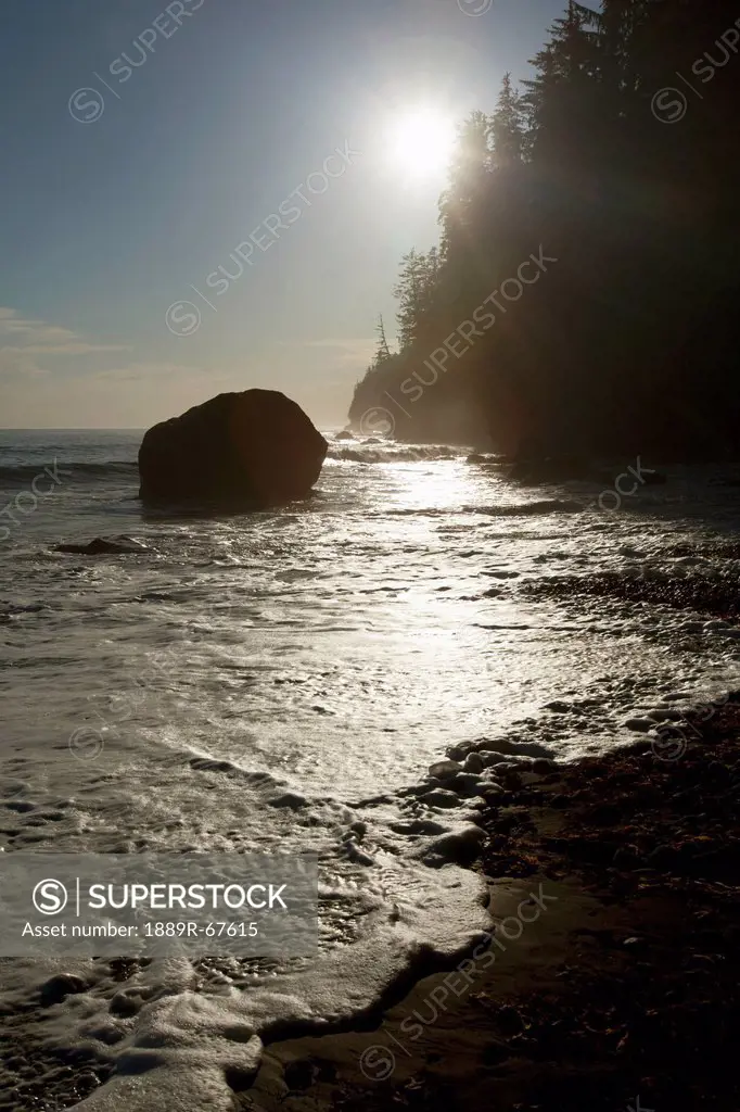 sunlight on seashore of the juan de fuca marine trail, mystic beach, vancouver island, british columbia, canada