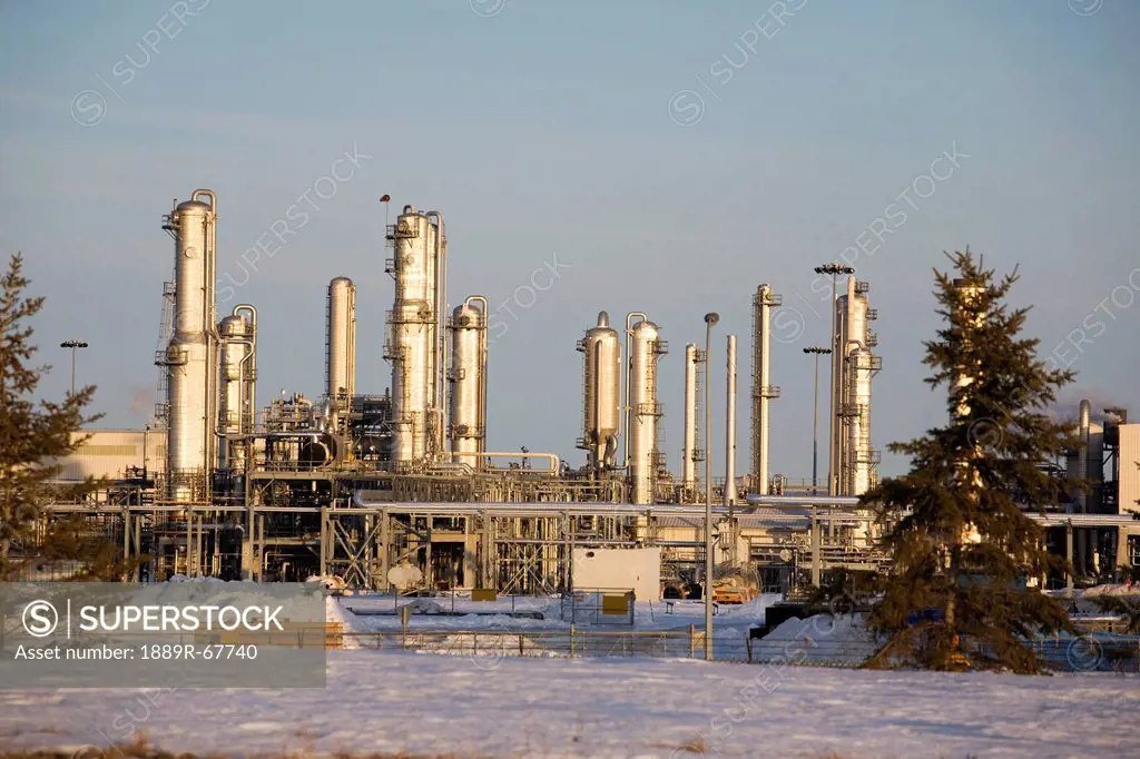 oil refinery towers in winter at sunset, fort saskatchewan, alberta, canada