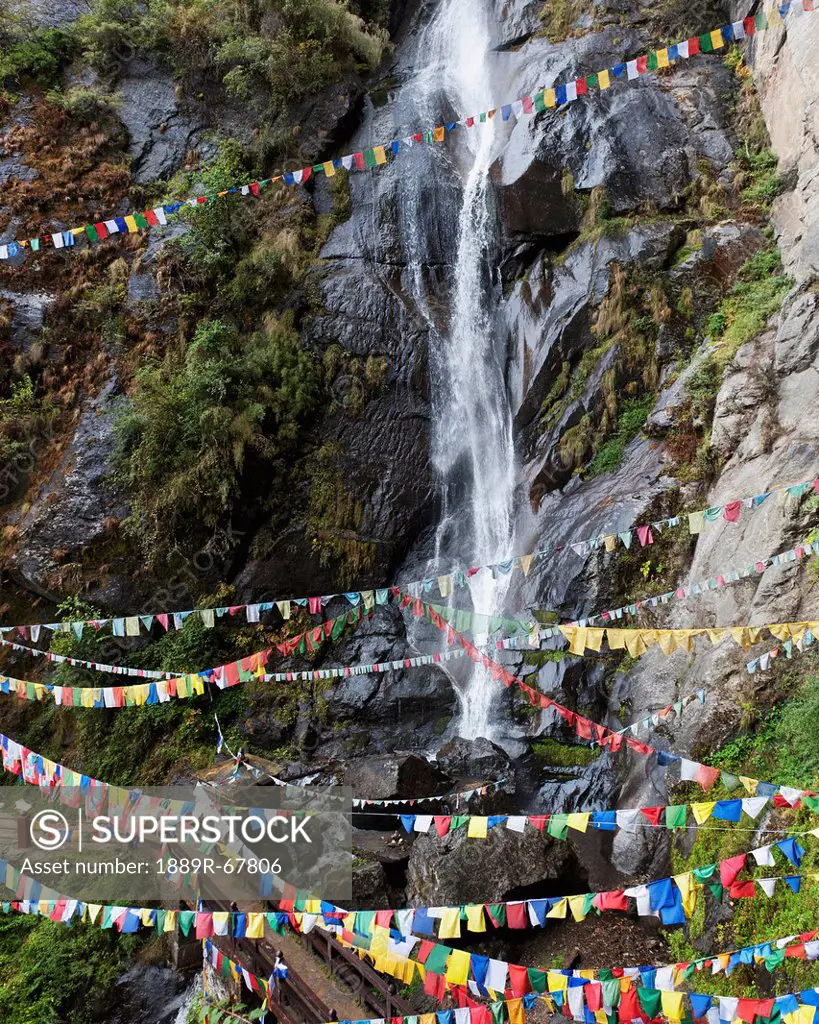 prayer flags in the buddhist tiger´s nest monastery, paro valley, taktsang, bhutan