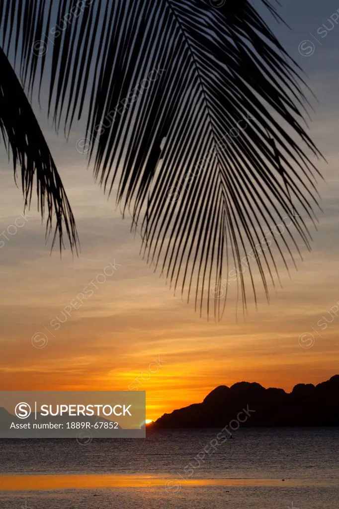 sunset view of tropical islands from the beaches of corong corong, el nido, bacuit archipelago, palawan, philippines