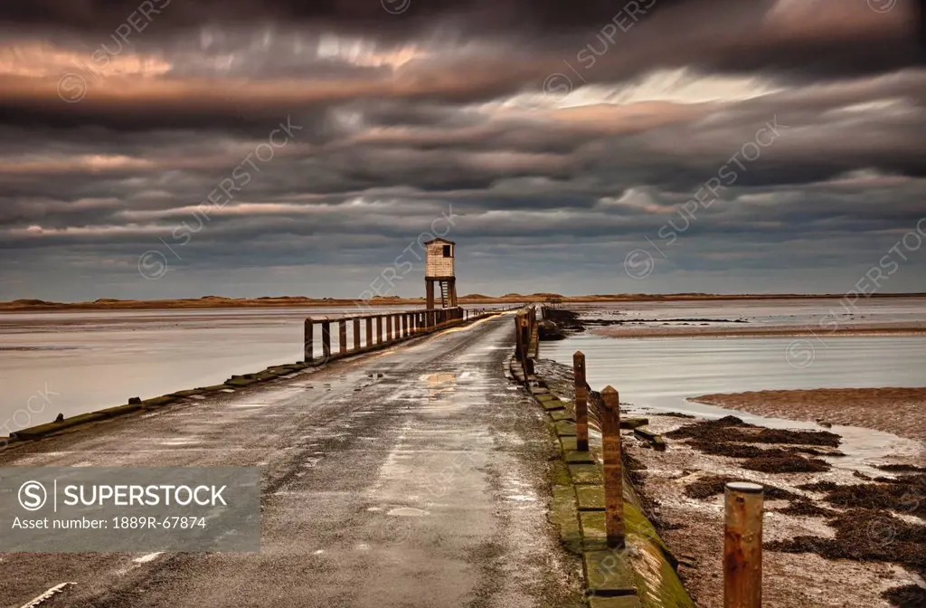 the causeway from holy island, northumberland england