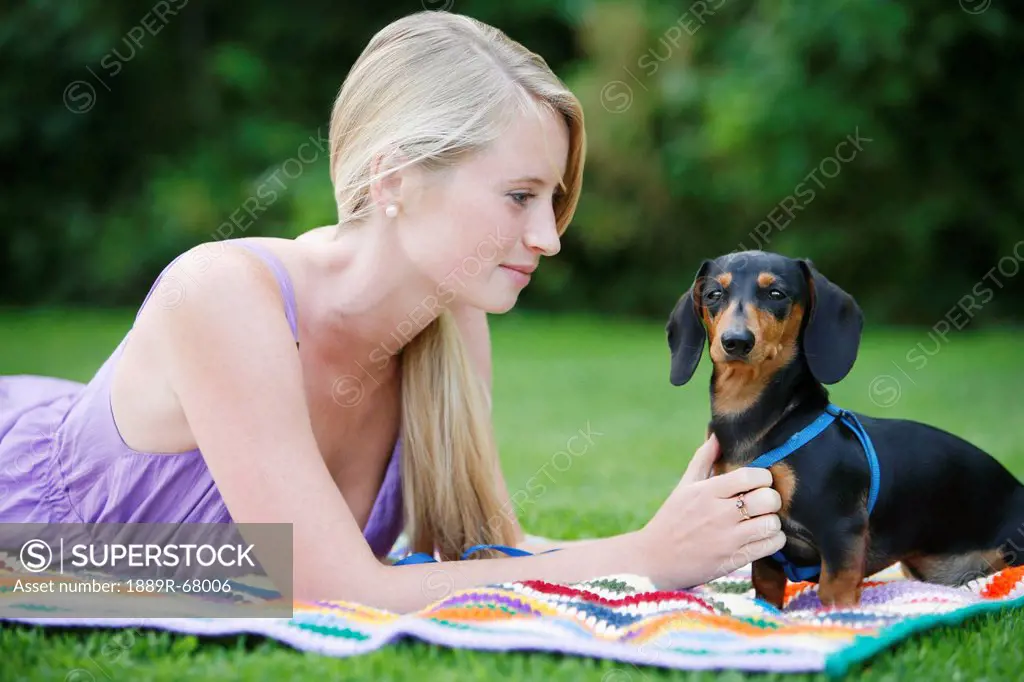 a young woman with her mini dachshund dog, victoria british columbia canada