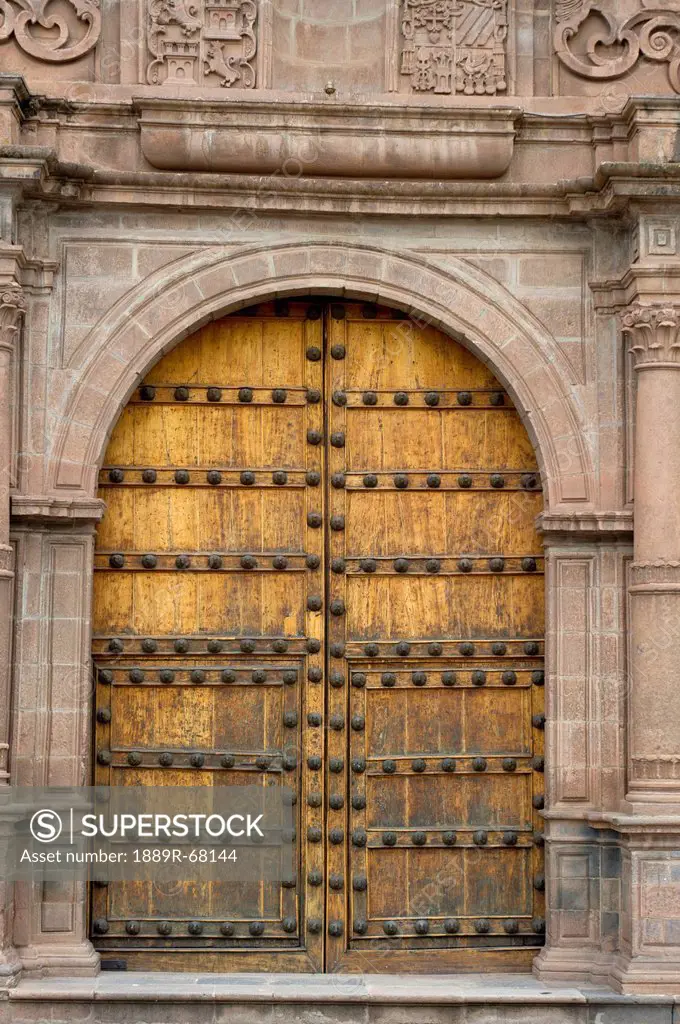 double doors to an ornate building, cusco peru