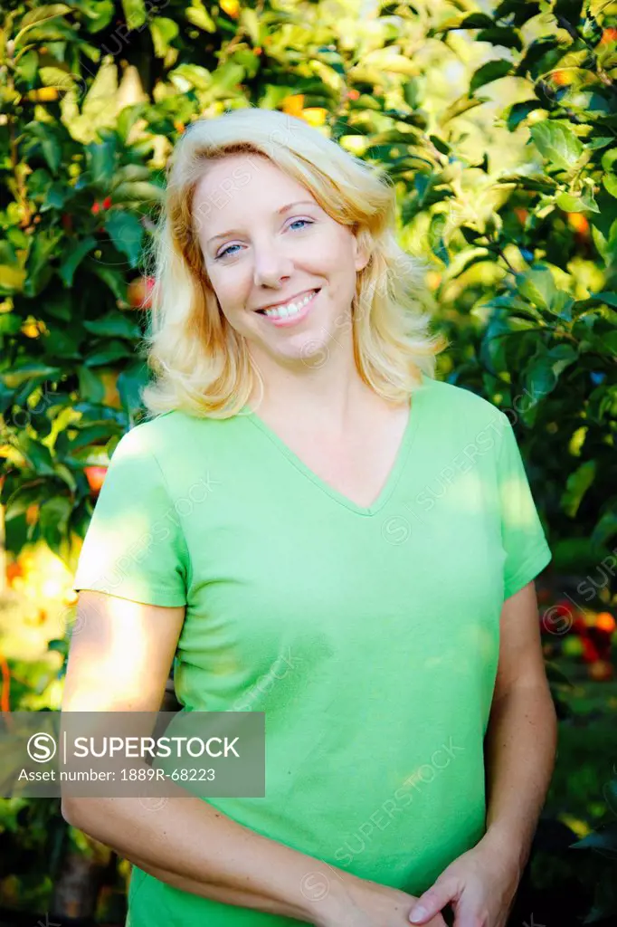 portrait of a woman in an apple orchard, nooksack washington united states of america