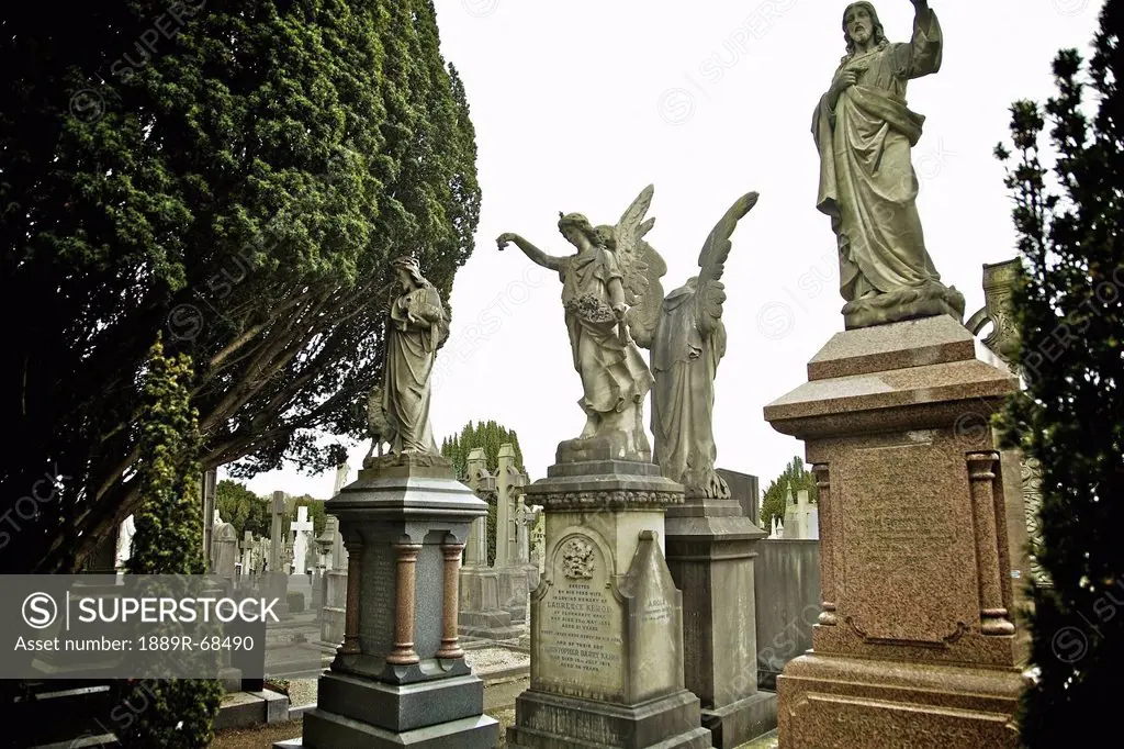 statues on graves in glasnevin cemetery, dublin county dublin ireland