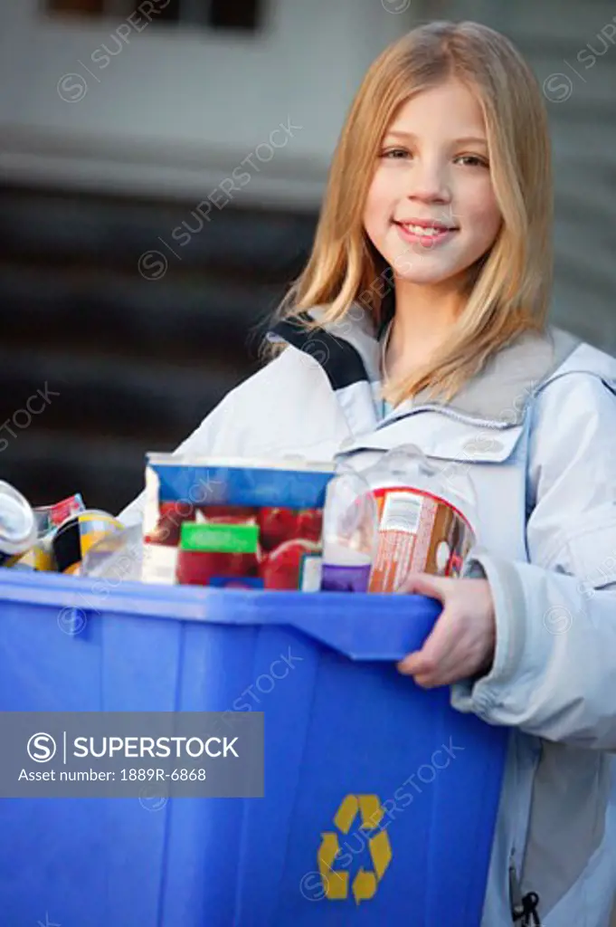 Young girl recycling