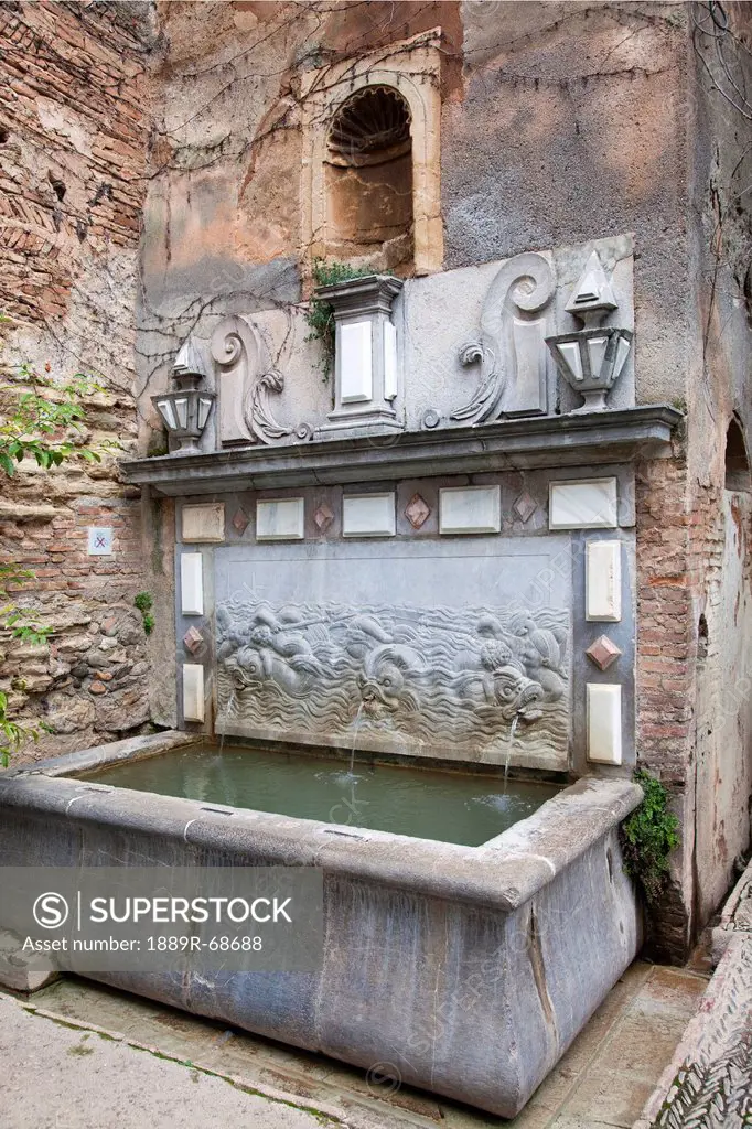 an old water fountain in the alhambra, granada andalucia spain