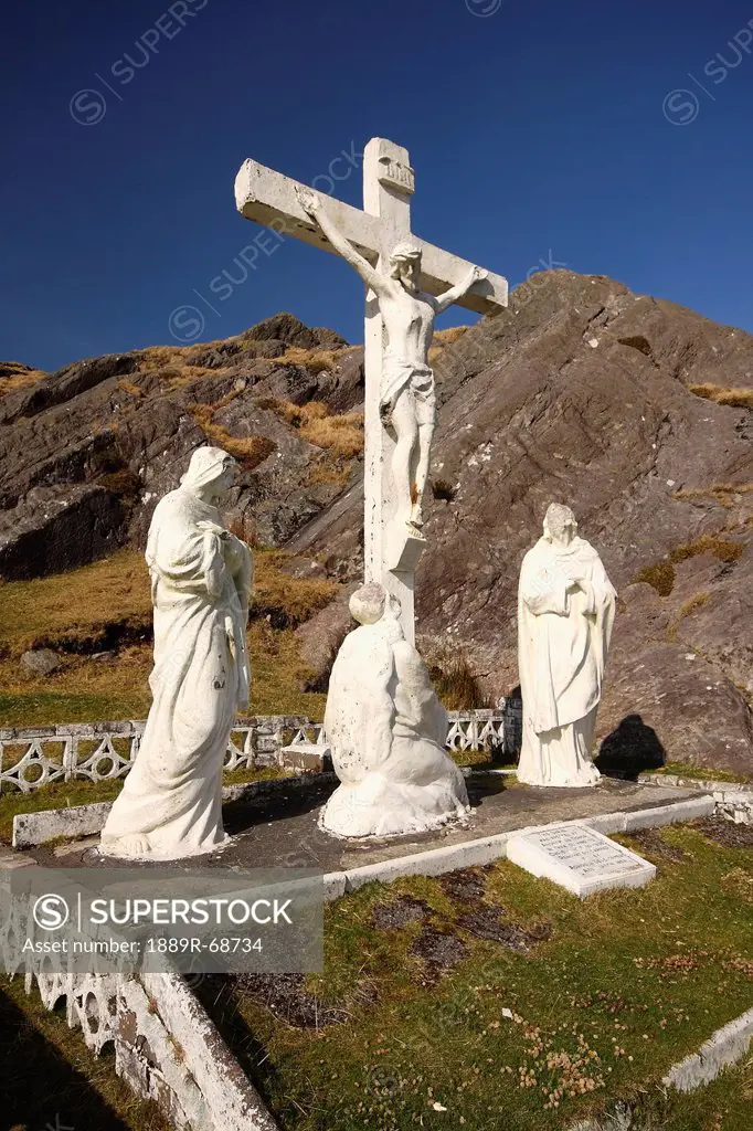 crucifix and holy statues at the top of healy pass, county cork ireland