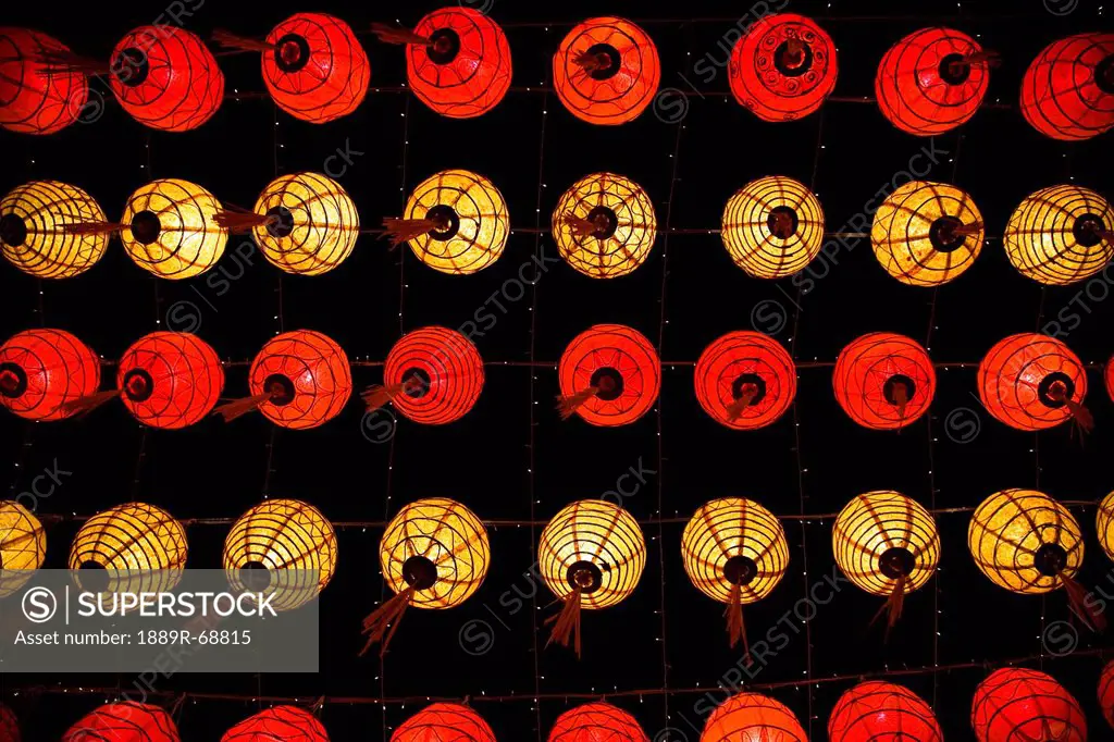 red and yellow chinese lanterns hanging from the ceiling, chiang mai thailand