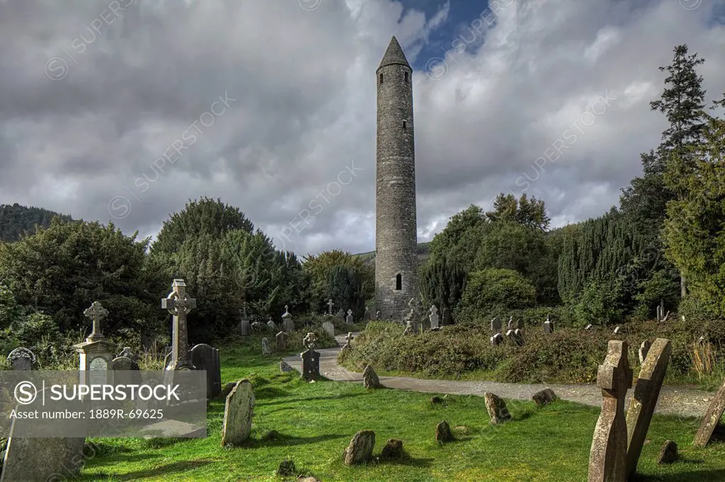 round tower in a graveyard, glendalough county wicklow ireland