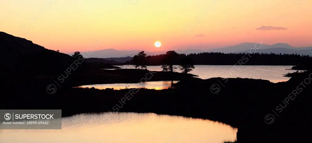 the cloonee lakes at sunset, tuosist county kerry ireland