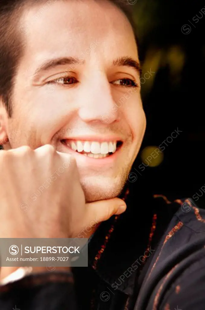A man smiles