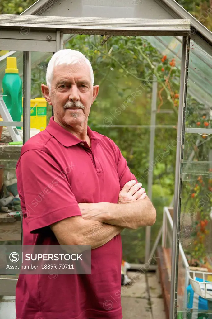 a man standing in front of a greenhouse, naas, county kildare, ireland