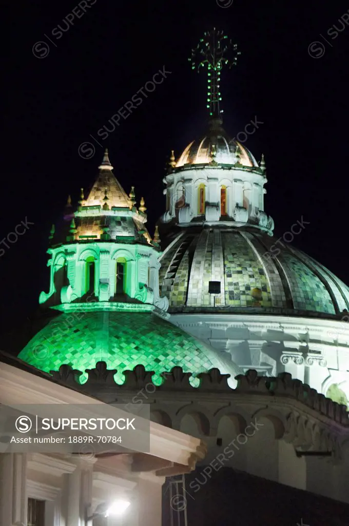 a building with a domed roof illuminated by green light, quito, equador