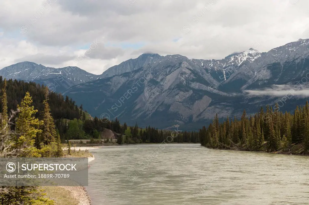a river and the rocky mountains, jasper, alberta, canada