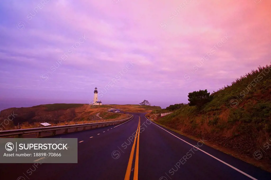 morning light over yaquina head lighthouse and the highway, newport oregon united states of america