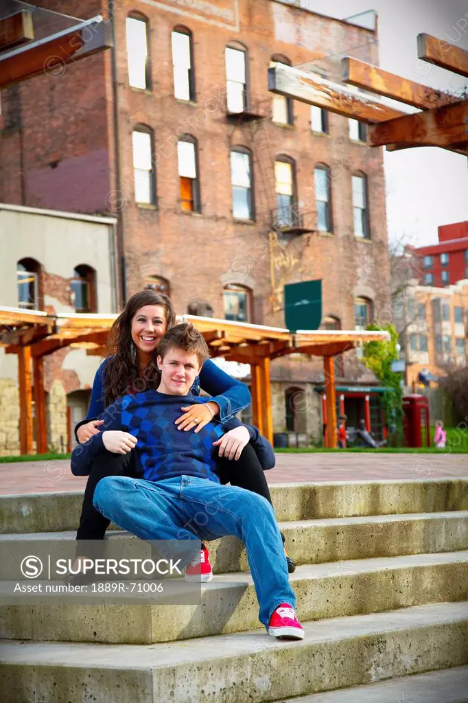 portrait of a young couple sitting on steps, bellingham washington united states of america