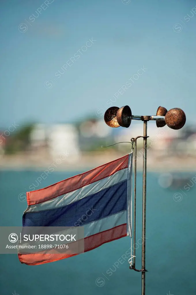 thai flag and weather vane, prachuap kiri khan prachuap province thailand