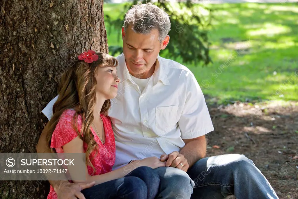 father and daughter spending quality time together in a park, edmonton alberta canada