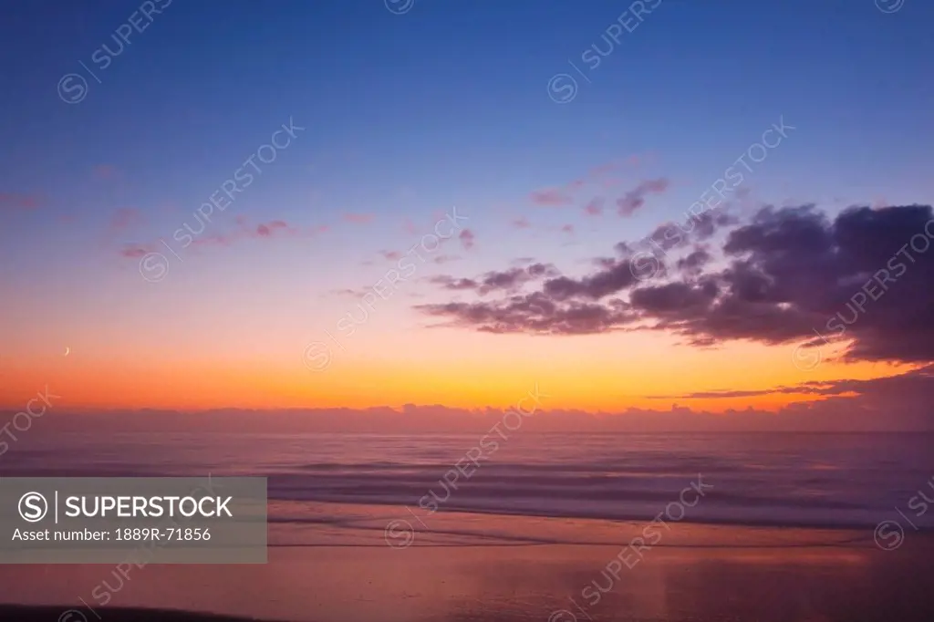 sunset over the ocean, newport oregon united states of america