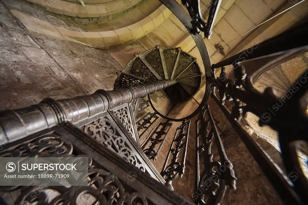 view up a metal spiral staircase, northumberland england