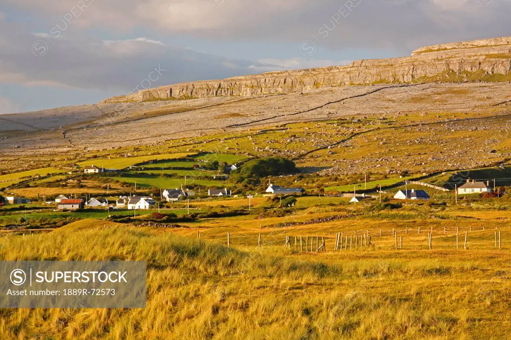 view of fanore village and limestone mountain in the background in the burren region, county clare ireland