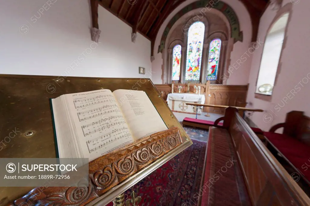 An Open Hymnal On A Stand Inside A Church, Northumberland England