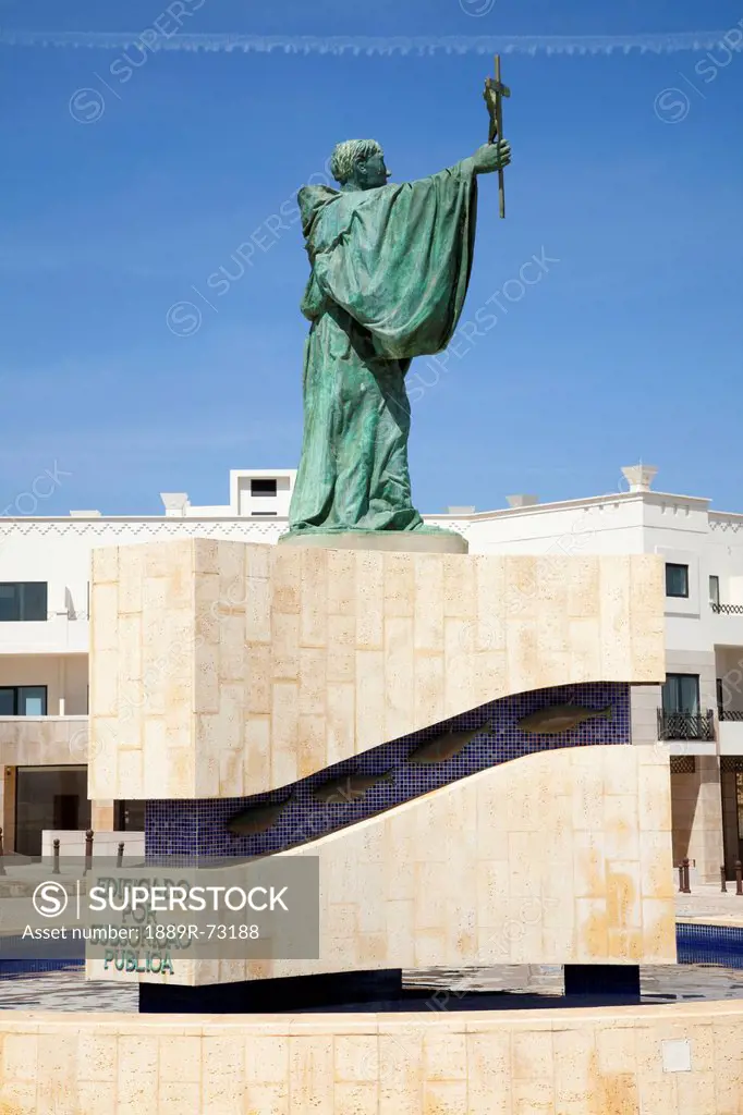 Green Statue Of A Male Figure Holding A Cross, Lagos Algarve Portugal