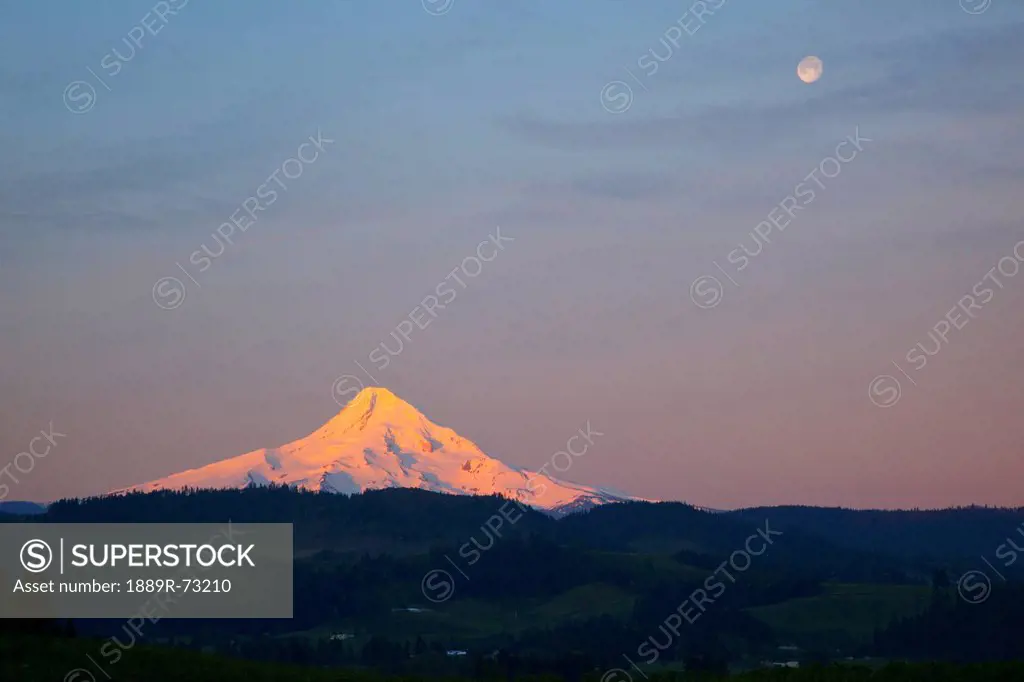 Sunrise Over Mount Hood With The Moon In The Sky, Oregon United States Of America