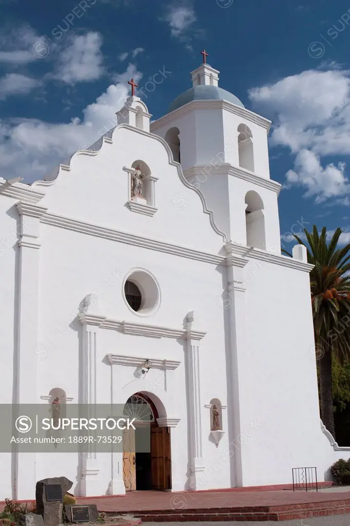 White Church Entrance With Steeple And Blue Sky And Clouds, Oceanside California United States Of America