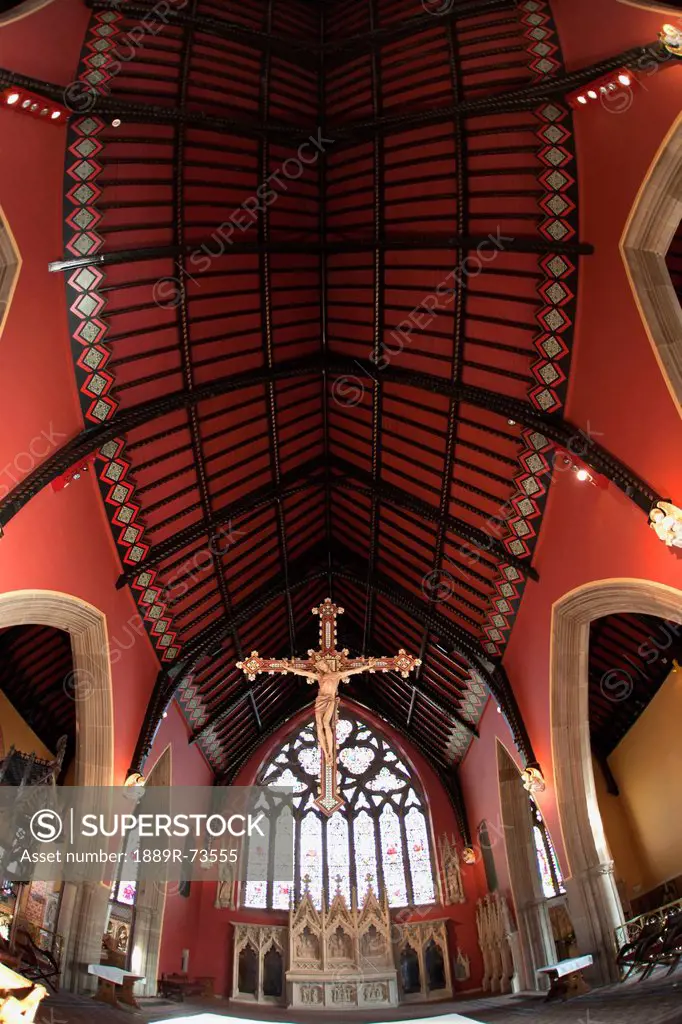 A Golden Crucifix Hanging Inside A Church, Northumberland England