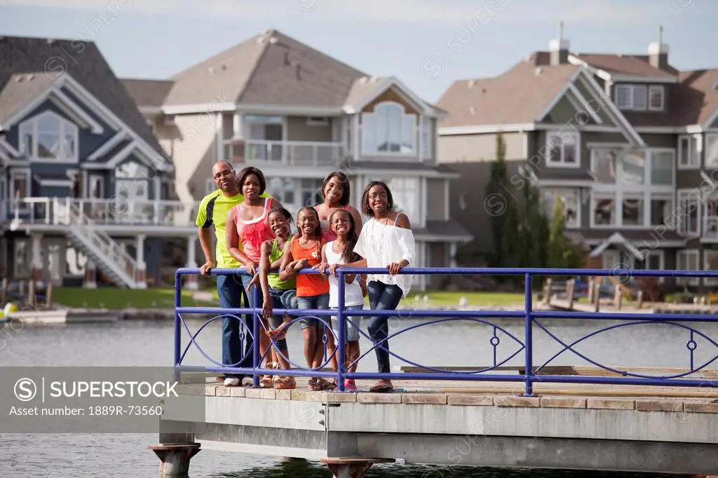 Family On A Pier In A Residential Lake Community, Edmonton Alberta Canada