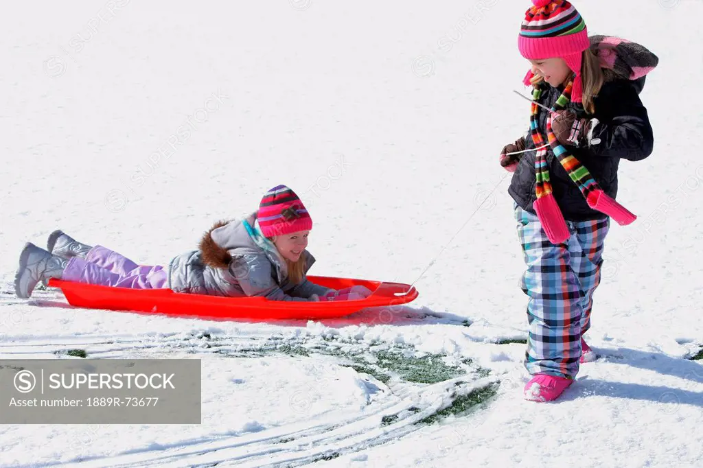 Two Girls Playing In The Snow, Troutdale Oregon United States Of America