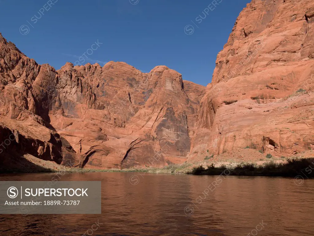 Rock Cliffs Along The Shoreline Of The Colorado River, Arizona United States Of America