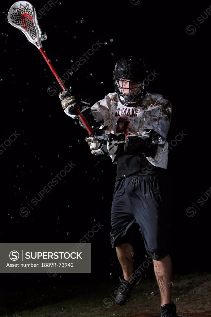 Lacrosse player playing in the rain at night, troutdale oregon united states of america