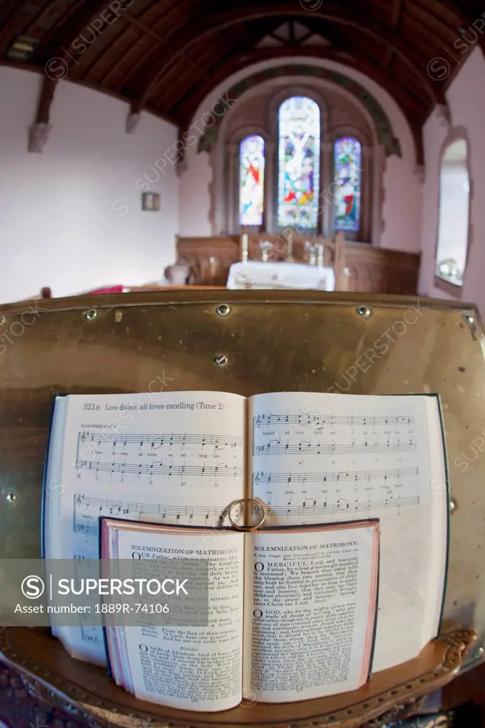 An Open Hymnal And Bible On A Podium Inside A Church, Northumberland England