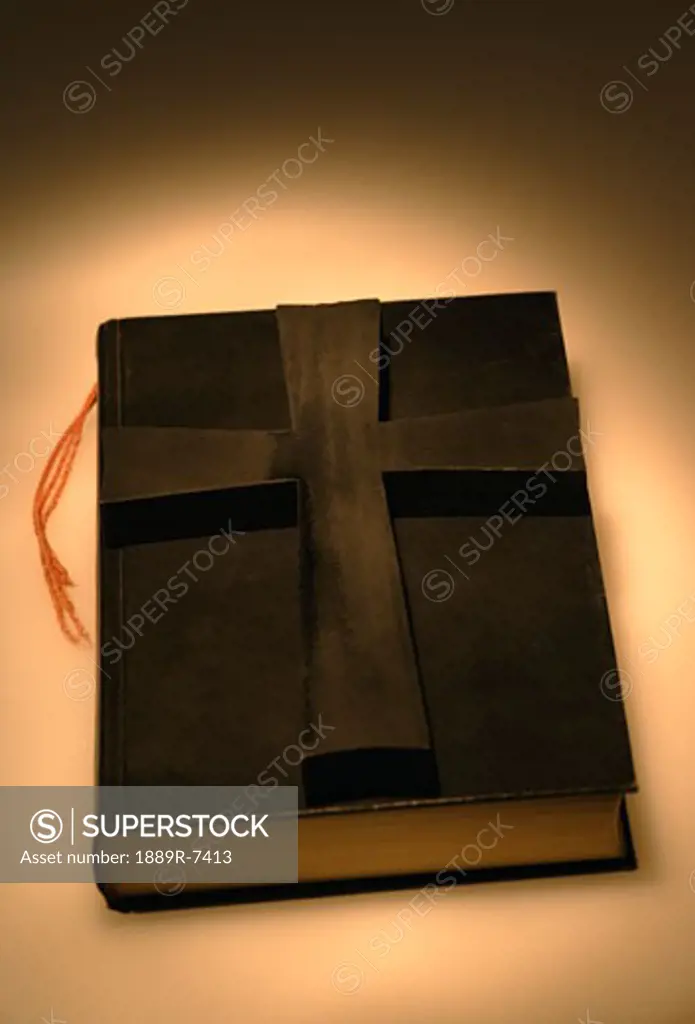Cross on bible