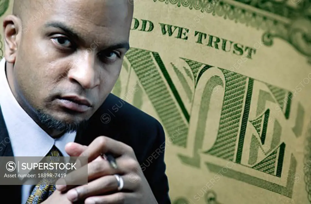 American dollar bill with man deep in thought